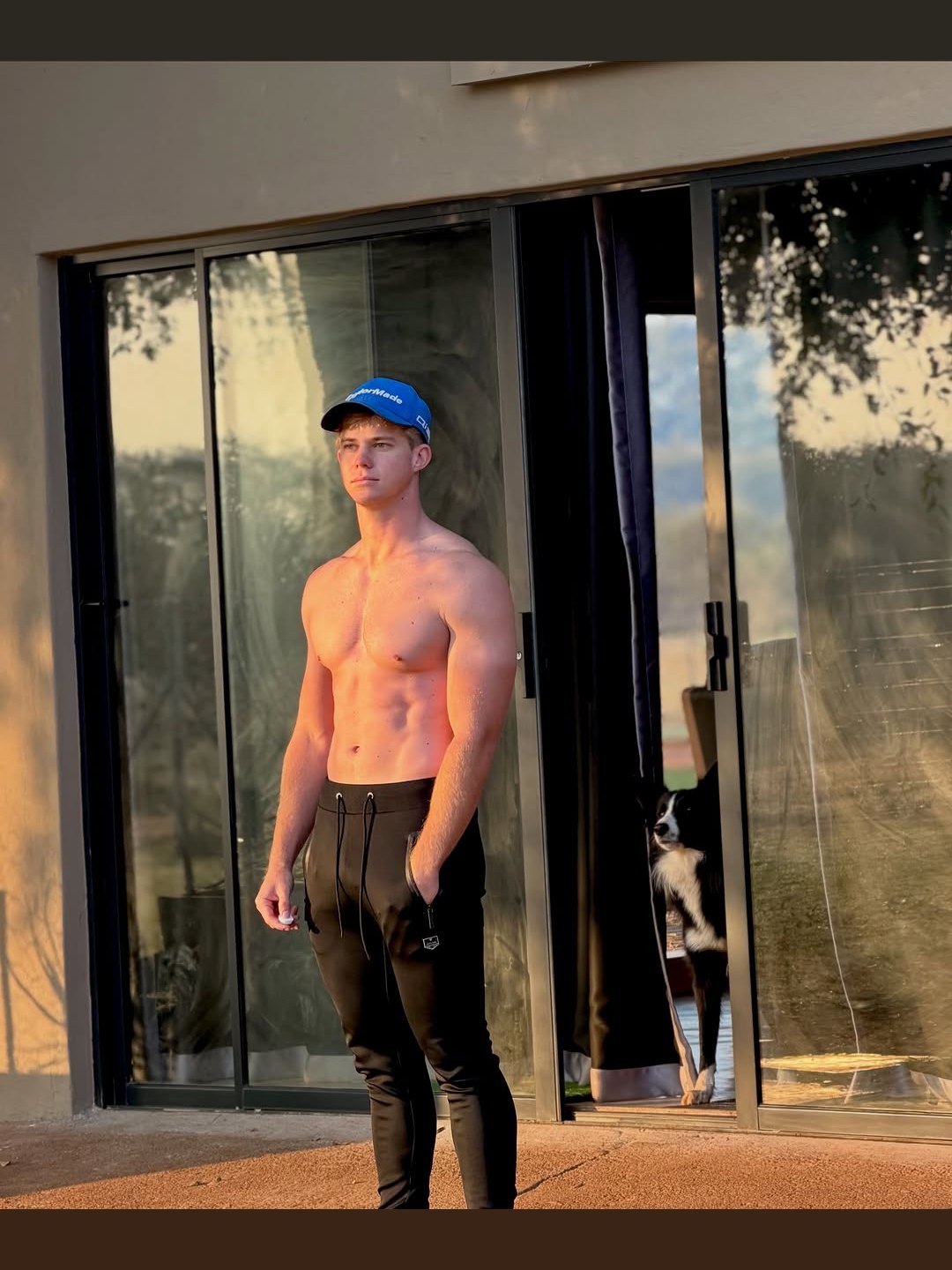Nikus Lourens standing in evening light, the physique he built on the system he coaches
